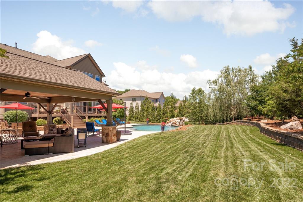 4040 Flowering Peach Road Marvin, NC 28173 - Photo 8 of 38 a view of a swimming pool with a patio