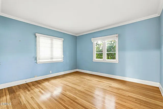 a bathroom with a granite countertop sink a toilet and a vanity