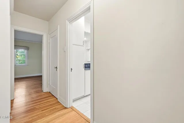 a house that has a tree in front of the house