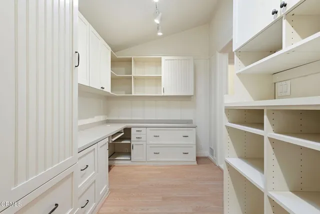 a view of kitchen with furniture and large windows