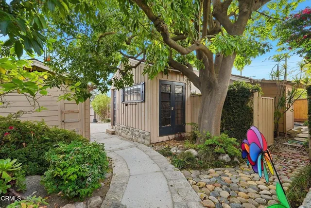 a kitchen with a sink cabinets and window