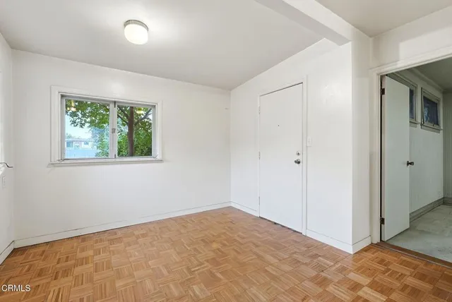 a kitchen with stainless steel appliances a sink a stove and a refrigerator