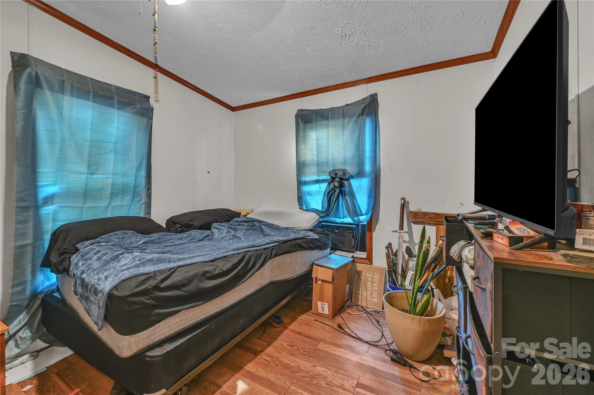 2571 Major Evans Road Lancaster, SC 29720 - Photo 12 of 19 a bedroom with a bed and wooden floor