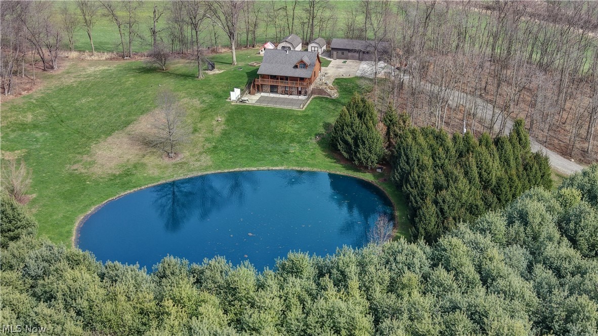 8045 McFadden Road Shreve, OH 44676 - Photo 4 of 45 View of subject property with a large body of water and a forest