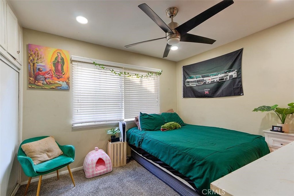 11523 Richeon Avenue Downey, CA 90241 - Photo 12 of 25 a bedroom with a bed and a window