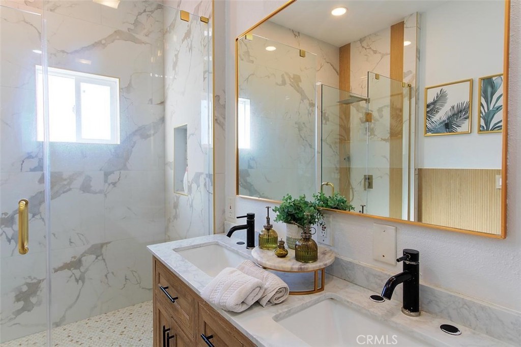 11523 Richeon Avenue Downey, CA 90241 - Photo 18 of 25 a bathroom with a granite countertop sink and a mirror