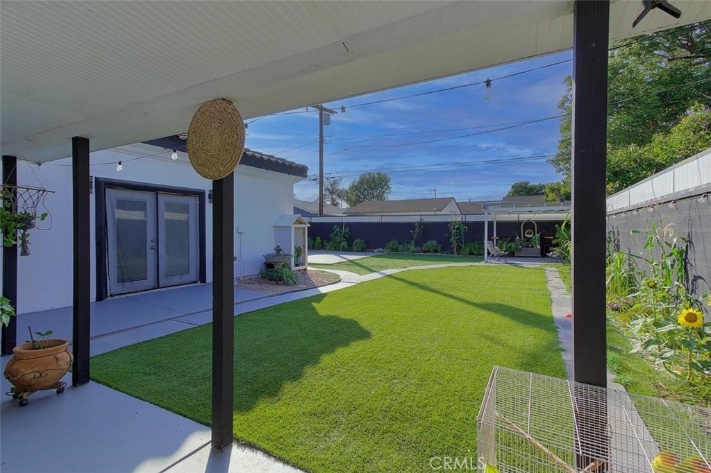 11523 Richeon Avenue Downey, CA 90241 - Photo 20 of 25 a view of a house with a backyard and porch