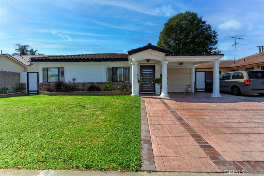 11523 Richeon Avenue Downey, CA 90241 - Photo 3 of 25 a front view of house with yard and green space
