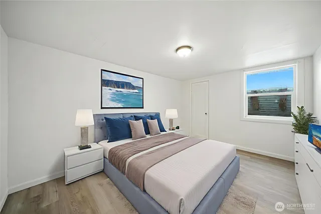 a bed room with a bed and a window