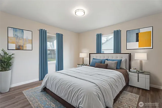 a bedroom with a bed and a potted plant