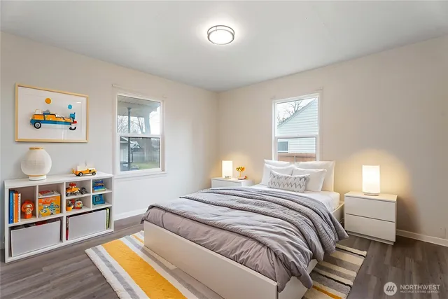 a bedroom with a bed and a bookshelf