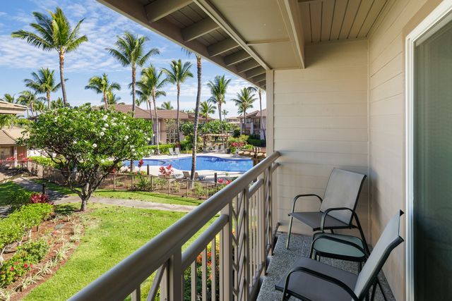 a view of swimming pool from a balcony