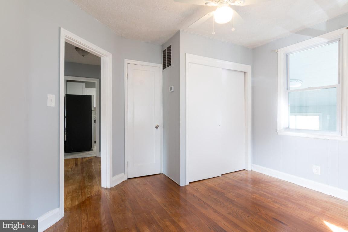 1715 Brookview Road Baltimore, MD 21222 - Photo 10 of 24 an empty room with wooden floor and closet