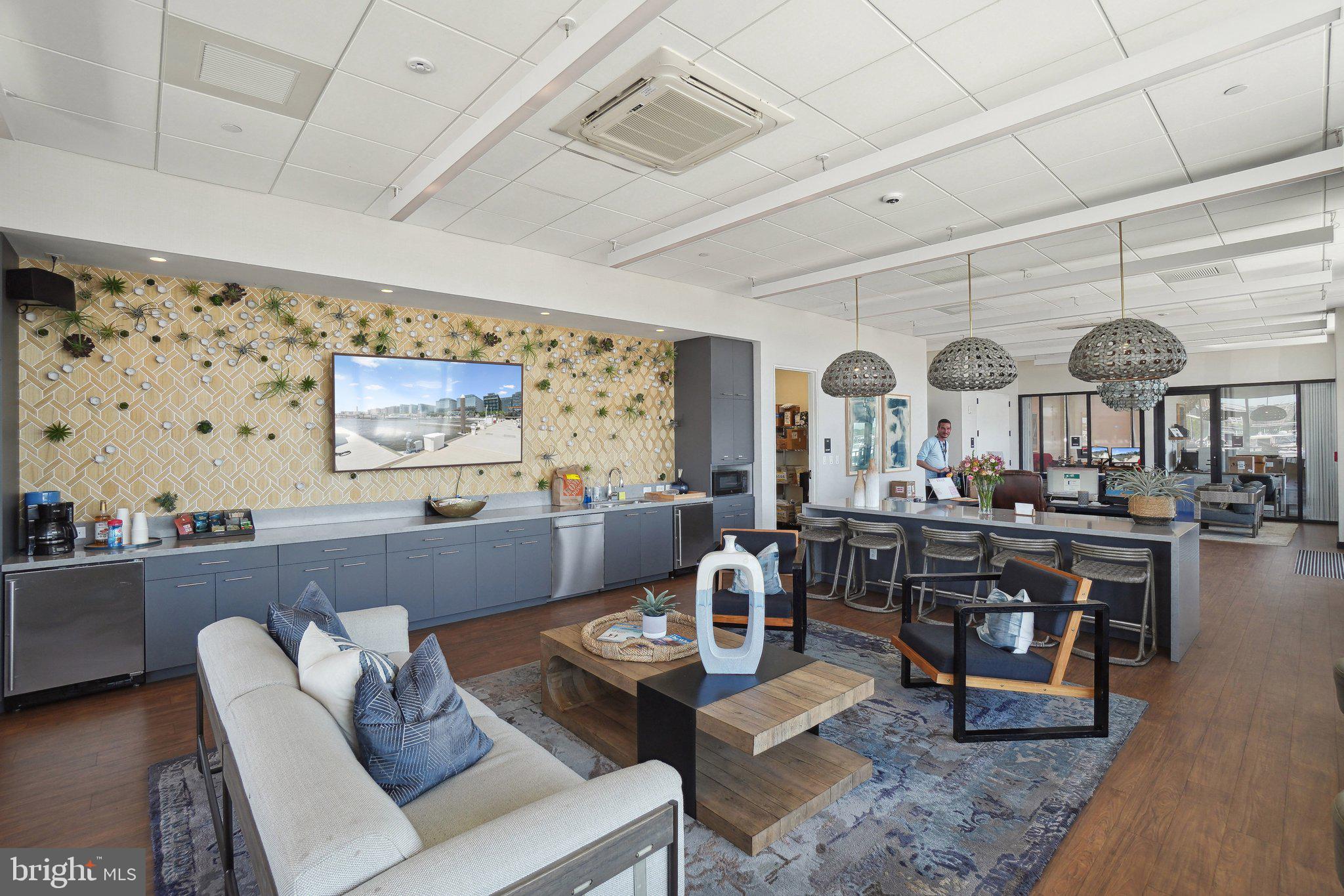650 Wharf Street Southwest, Unit Z01 Washington, DC 20024 - Photo 24 of 35 a living room with furniture and a large window