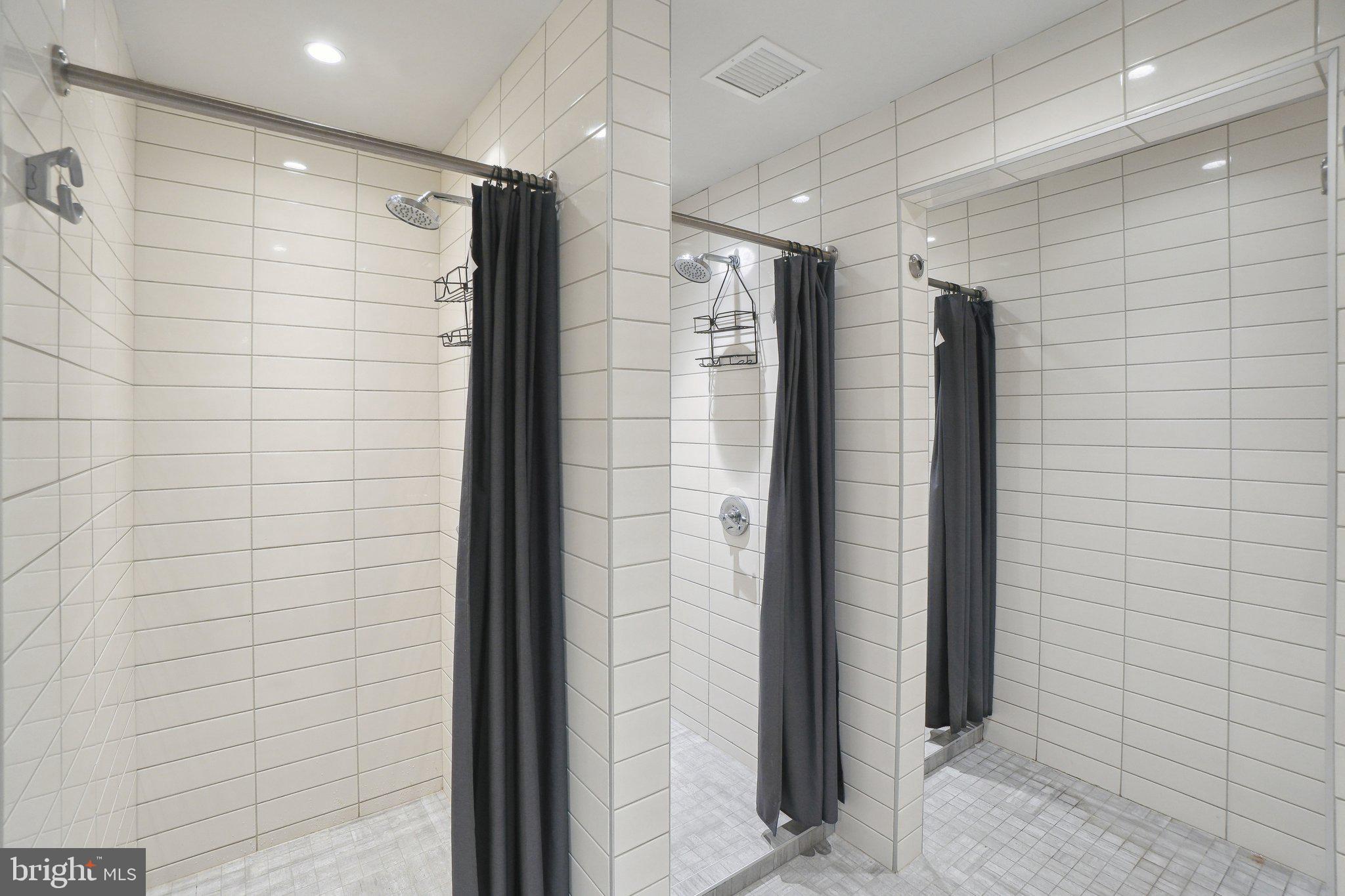 650 Wharf Street Southwest, Unit Z01 Washington, DC 20024 - Photo 25 of 35 a bathroom with a shower and a glass door