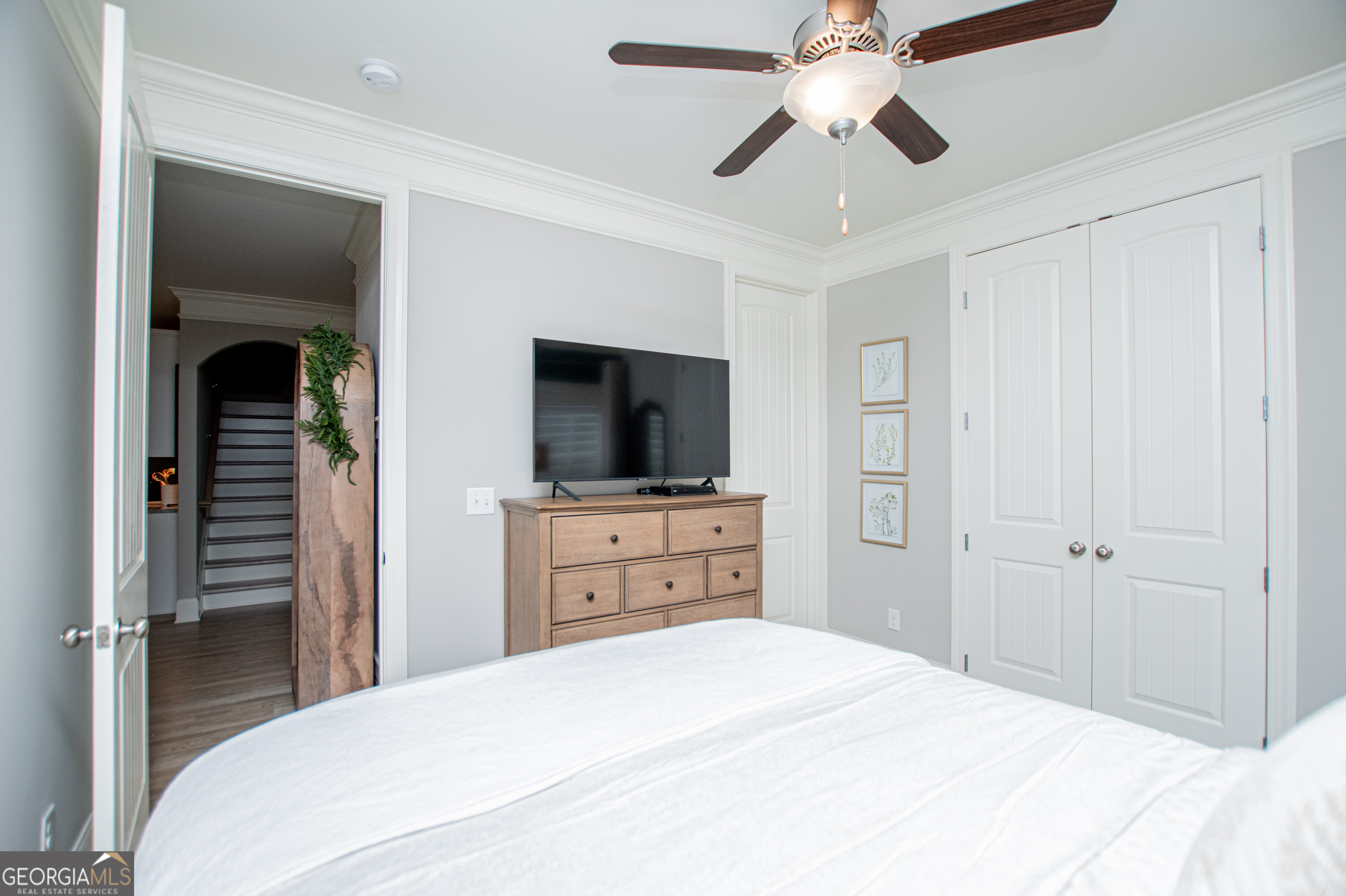 216 Yorkshire Lane Villa Rica, GA 30180 - Photo 55 of 94 a bedroom with a bed and a flat tv screen on dresser