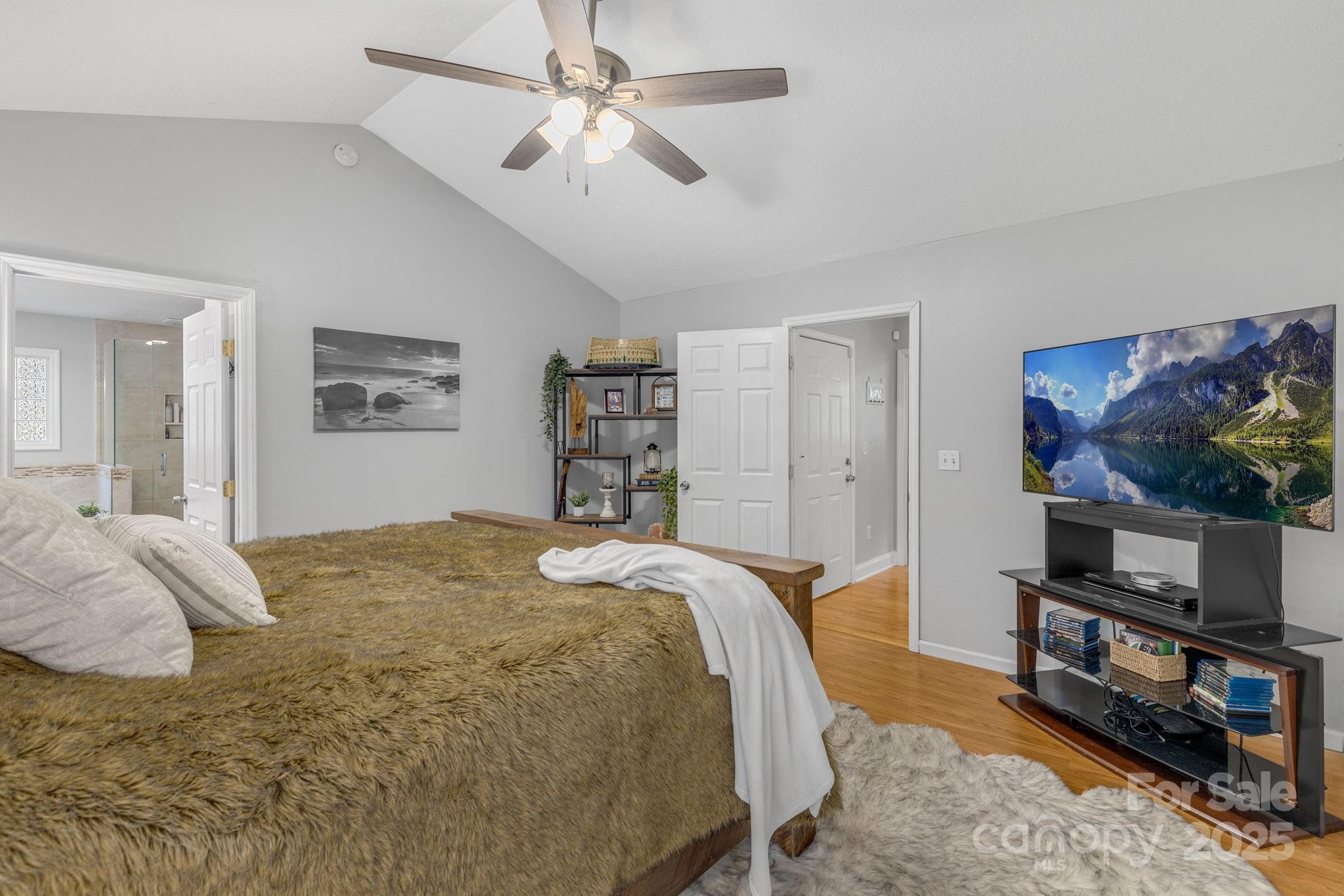 904 Mills Gap Road Fletcher, NC 28732 - Photo 15 of 36 a bedroom with a bed and a flat screen tv