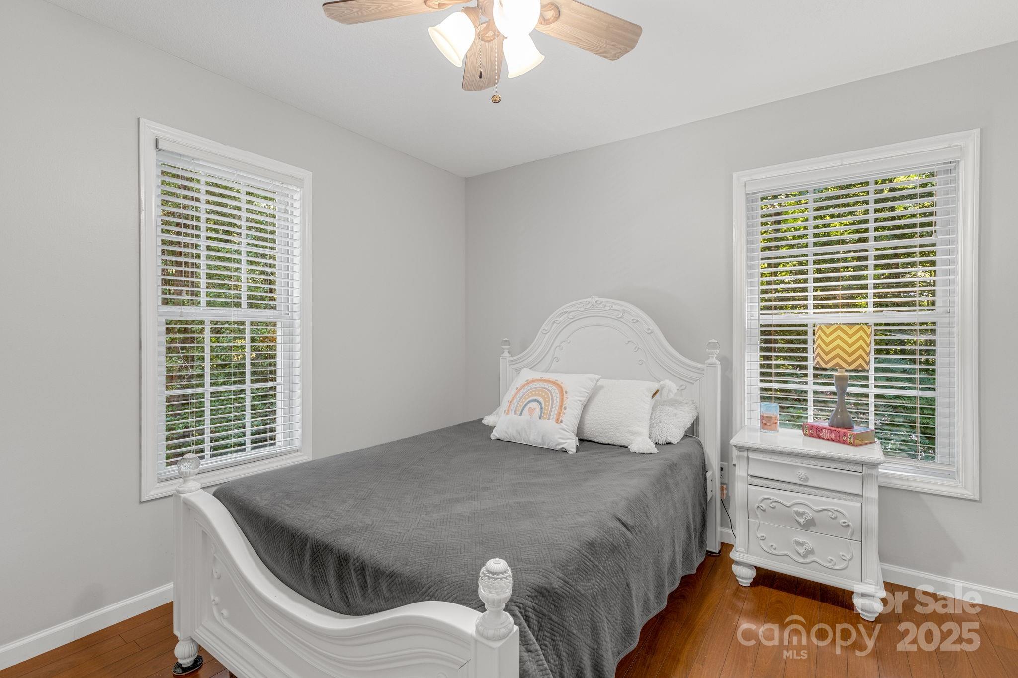 904 Mills Gap Road Fletcher, NC 28732 - Photo 20 of 36 a bedroom with a bed and a window