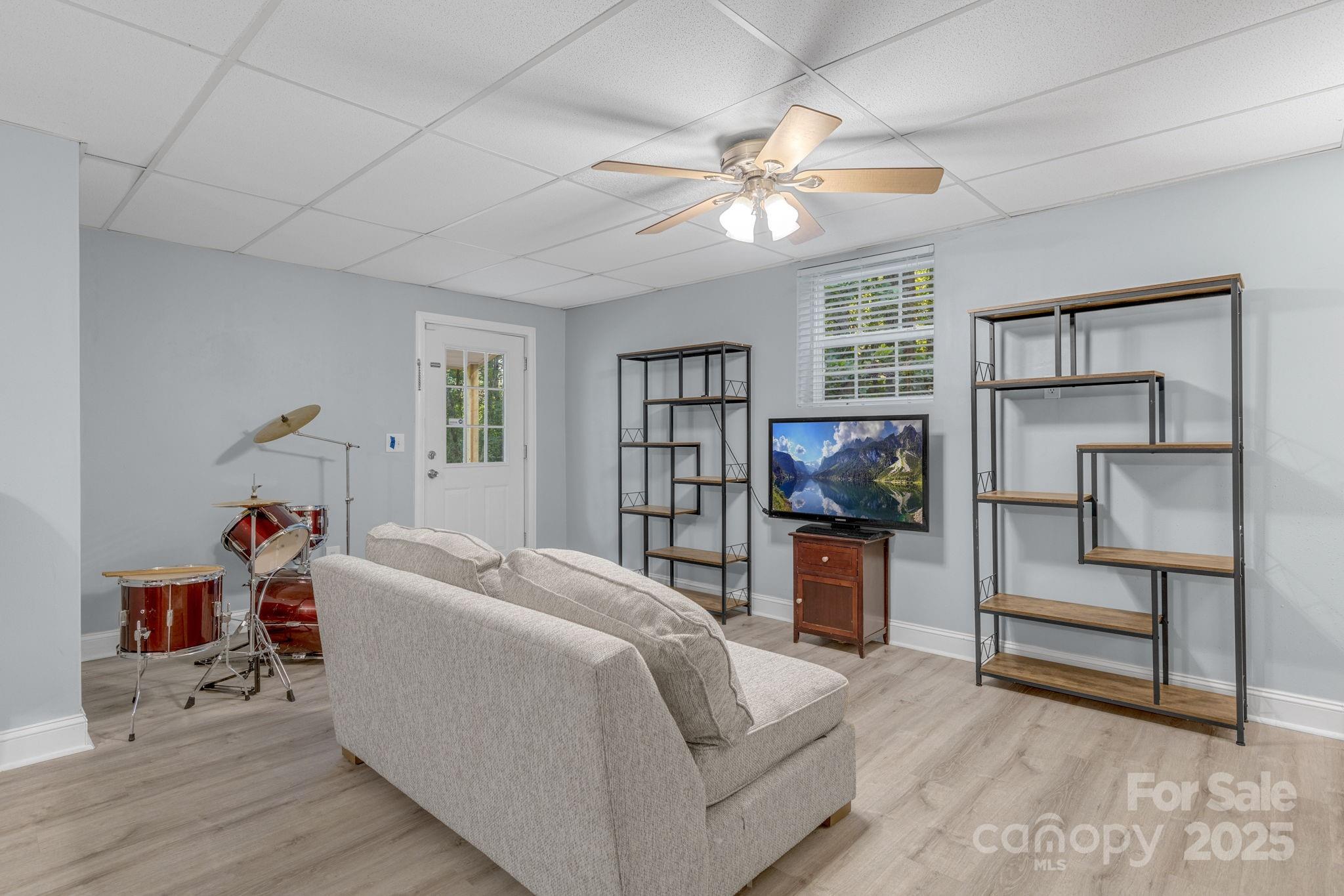 904 Mills Gap Road Fletcher, NC 28732 - Photo 25 of 36 a living room with furniture and a flat screen tv