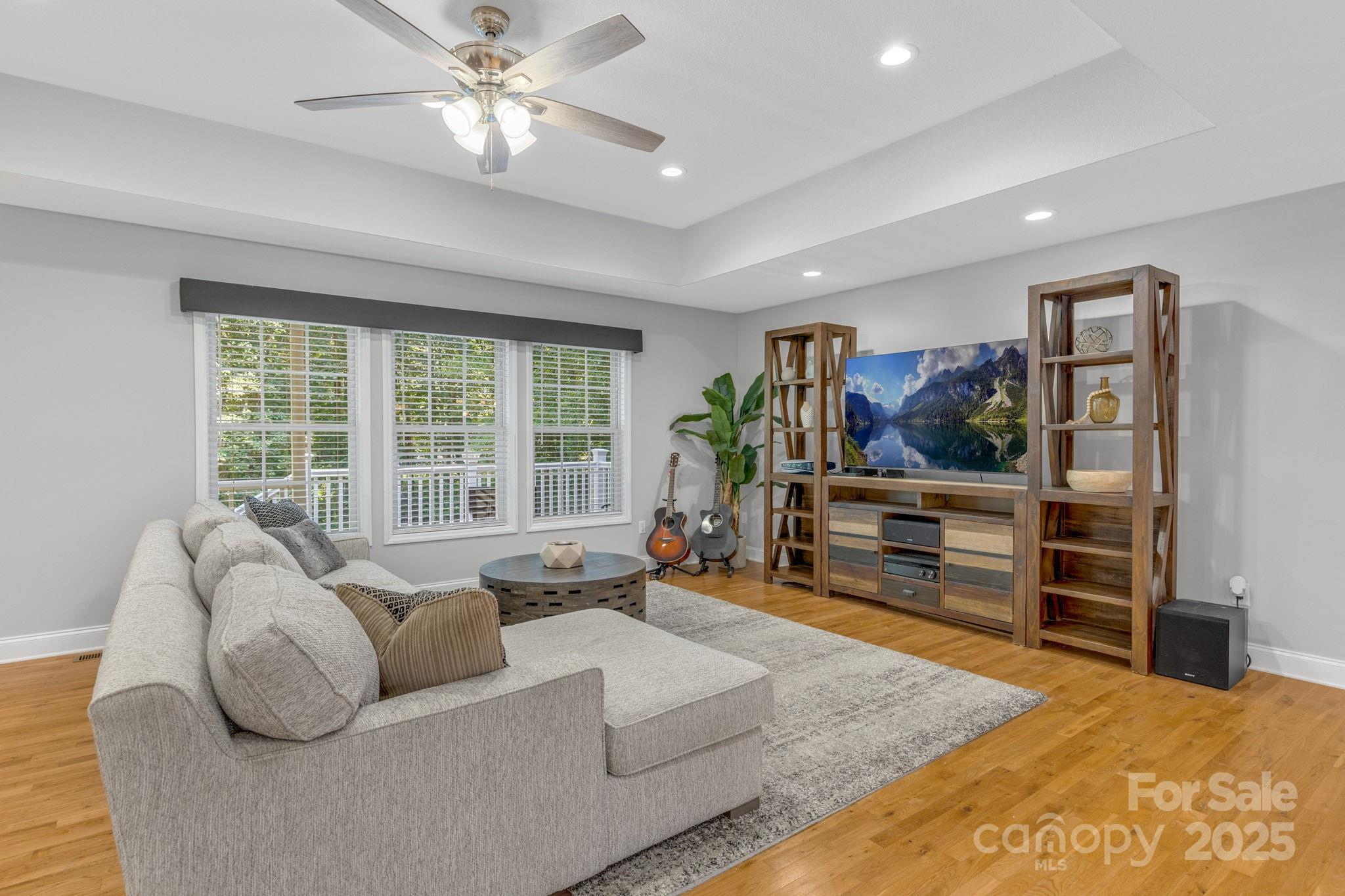 904 Mills Gap Road Fletcher, NC 28732 - Photo 6 of 36 a living room with furniture and a flat screen tv