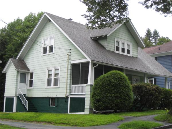 a view of house with a yard