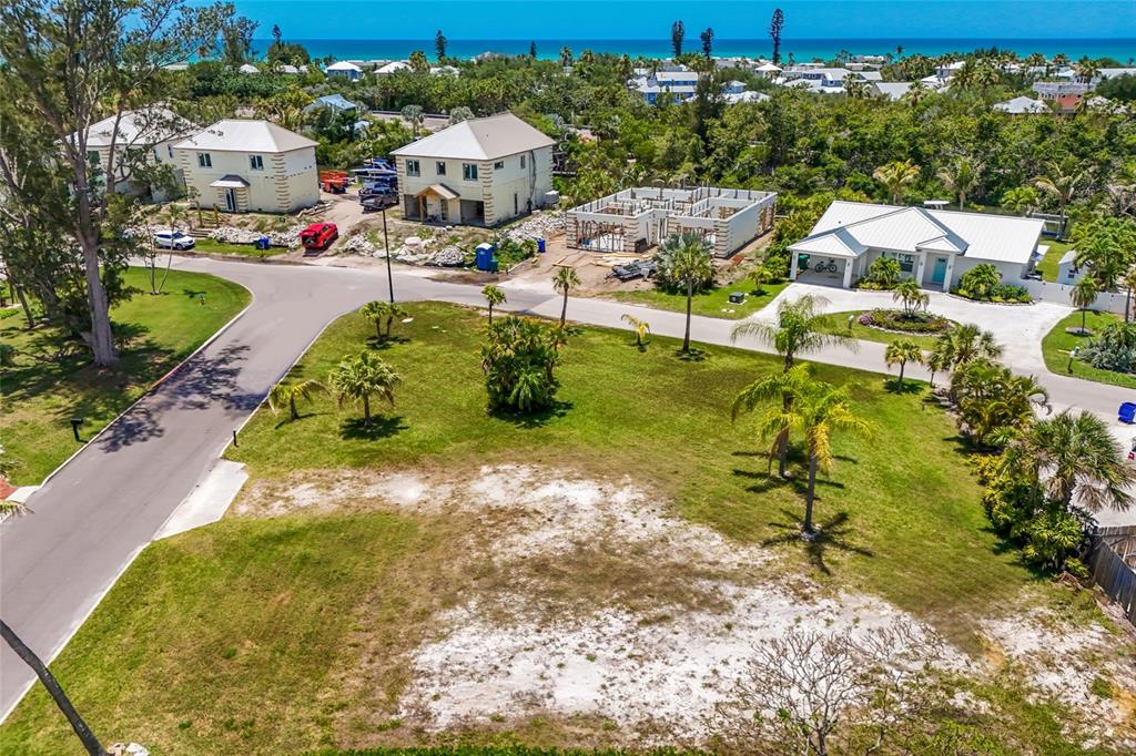 591 Russell Street Longboat Key, FL 34228 - Photo 10 of 19 a picture of houses with yard