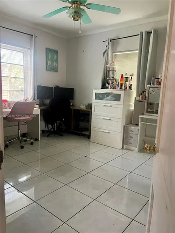 a room with a chair and gym equipment