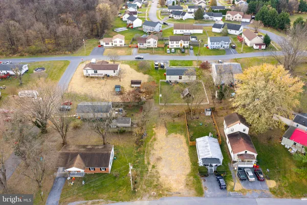 a aerial view of residential houses with outdoor space