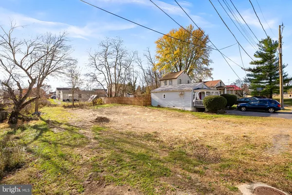 a view of a street with a building in the background