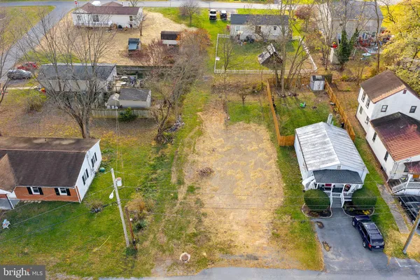 a aerial view of residential houses with outdoor space