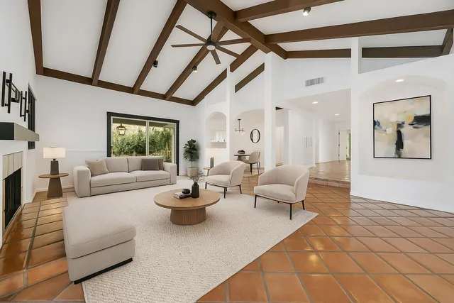 a kitchen with granite countertop a sink a window stainless steel appliances and cabinets