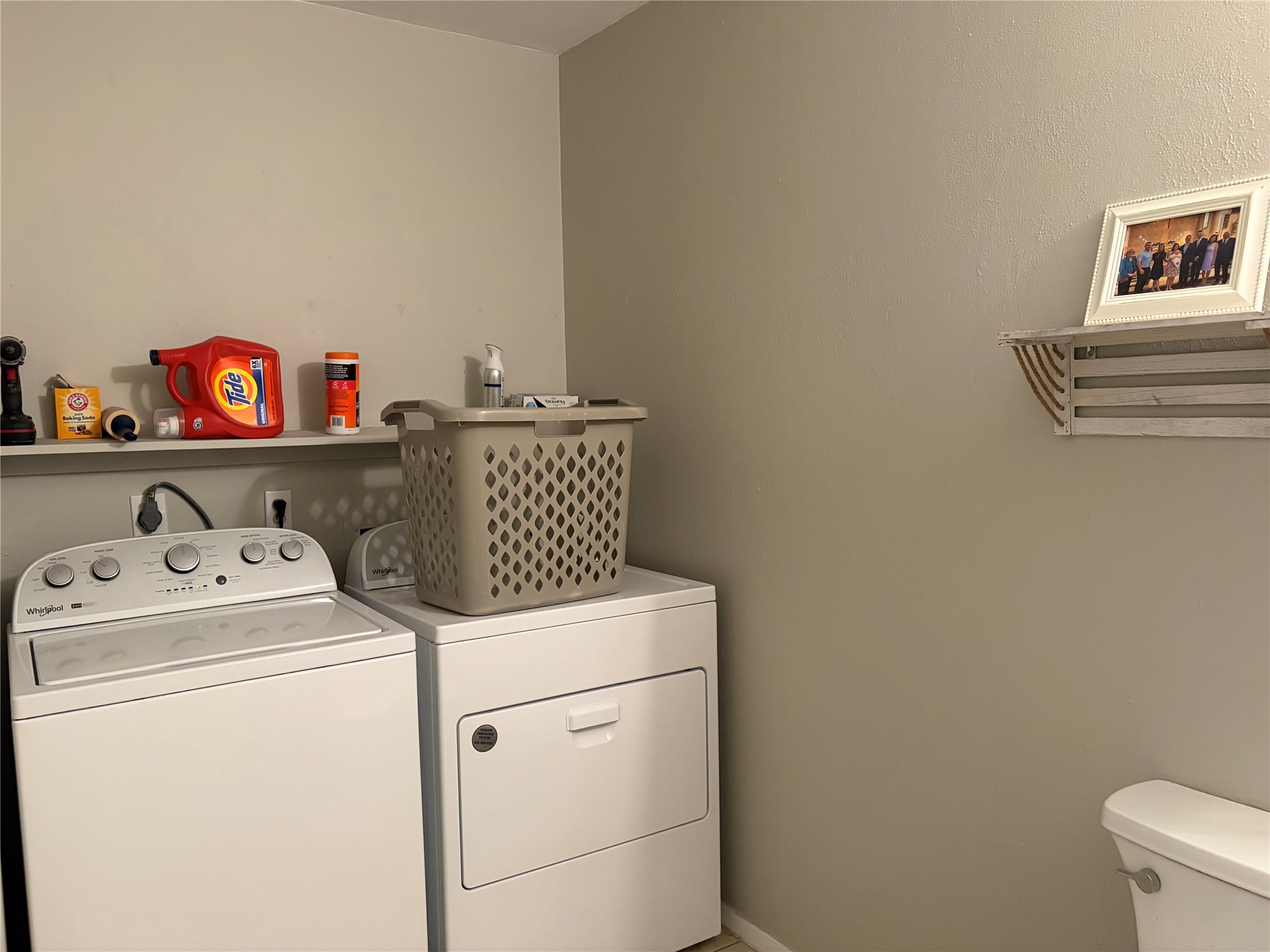 1400 Vista Ridge Cove, Unit B Austin, TX 78754 - Photo 12 of 25 A well-appointed laundry area features a washer and dryer, ensuring household chores are a breeze.