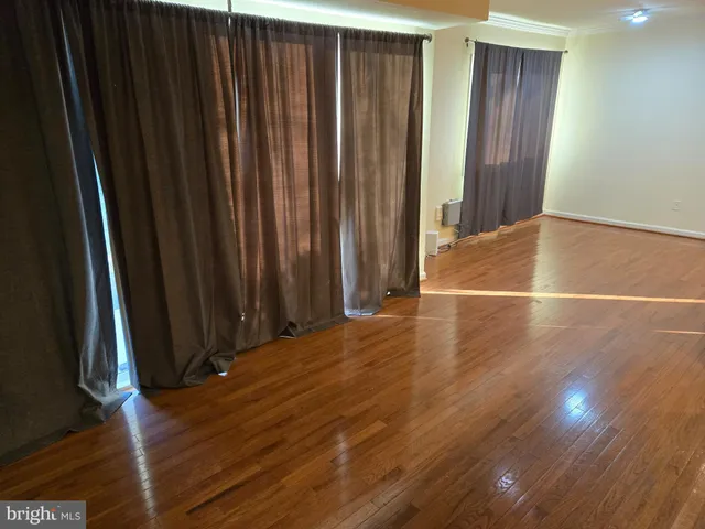 a view of a livingroom with wooden floor