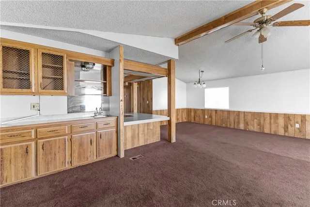a large kitchen with cabinets and a sink