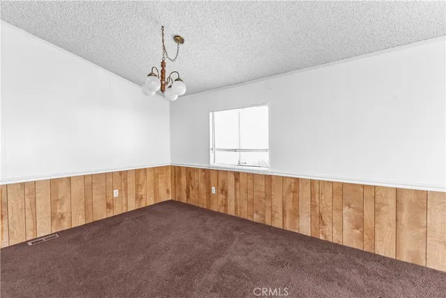 a view of an empty room with windows