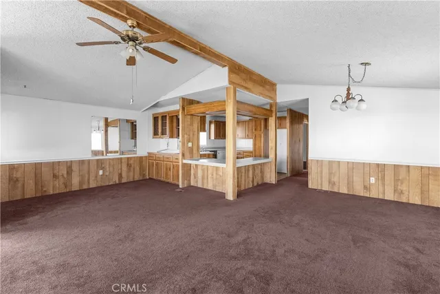 a view of an empty room with windows