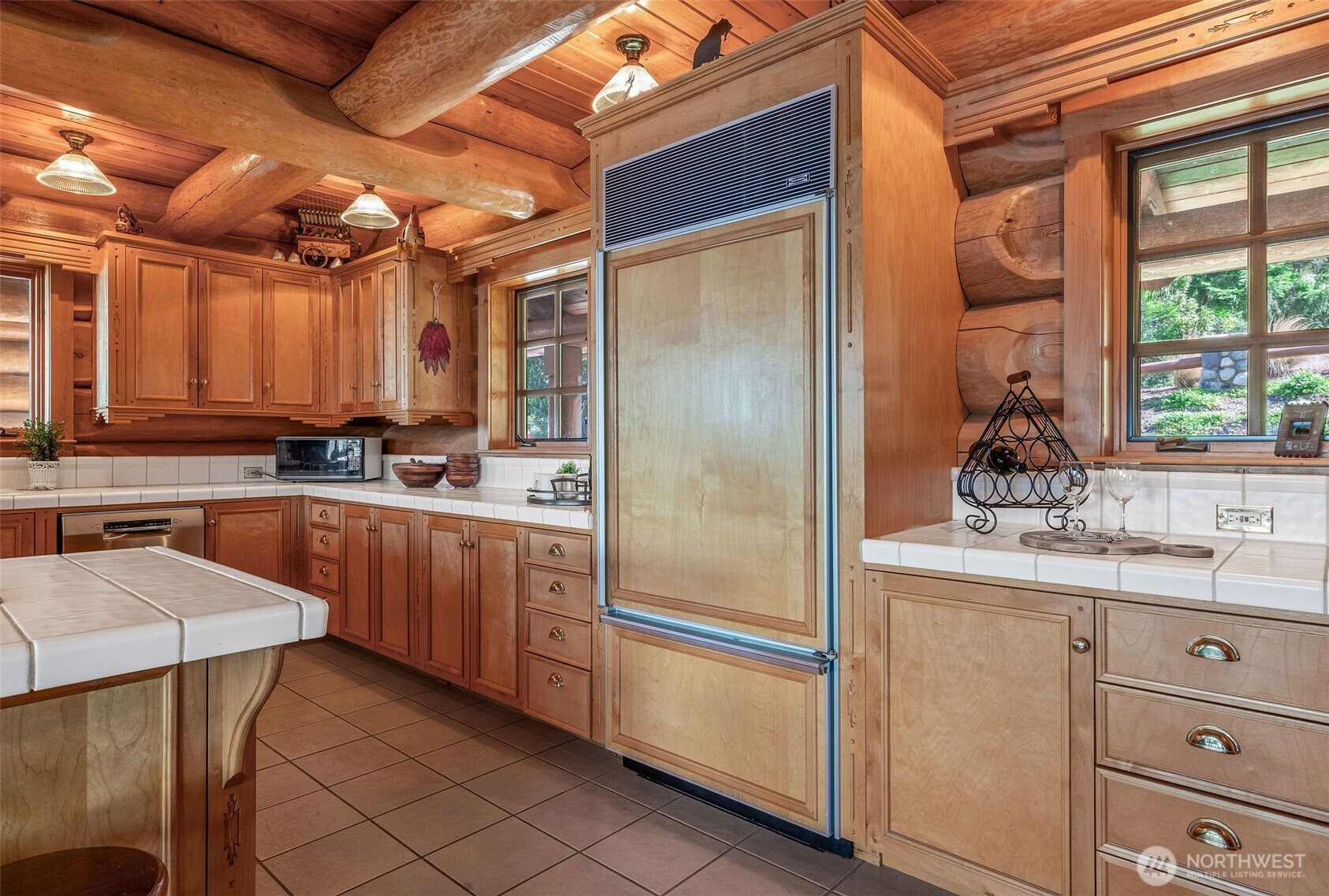 53 Combs Place Port Townsend, WA 98368 - Photo 14 of 40 a kitchen with stainless steel appliances granite countertop a refrigerator a sink and white cabinets