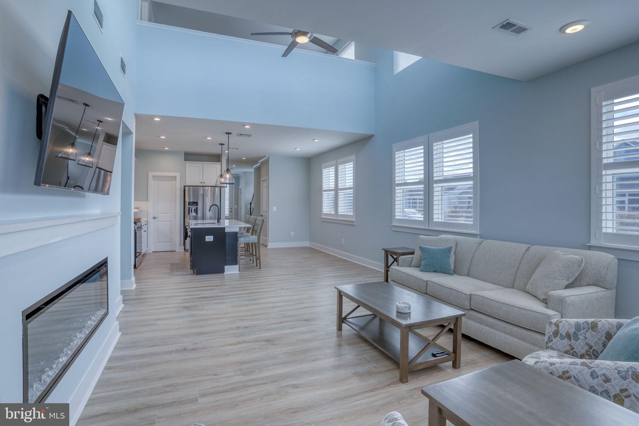 266 Exeter Street Ocean View, DE 19970 - Photo 15 of 62 a living room with furniture and a fireplace
