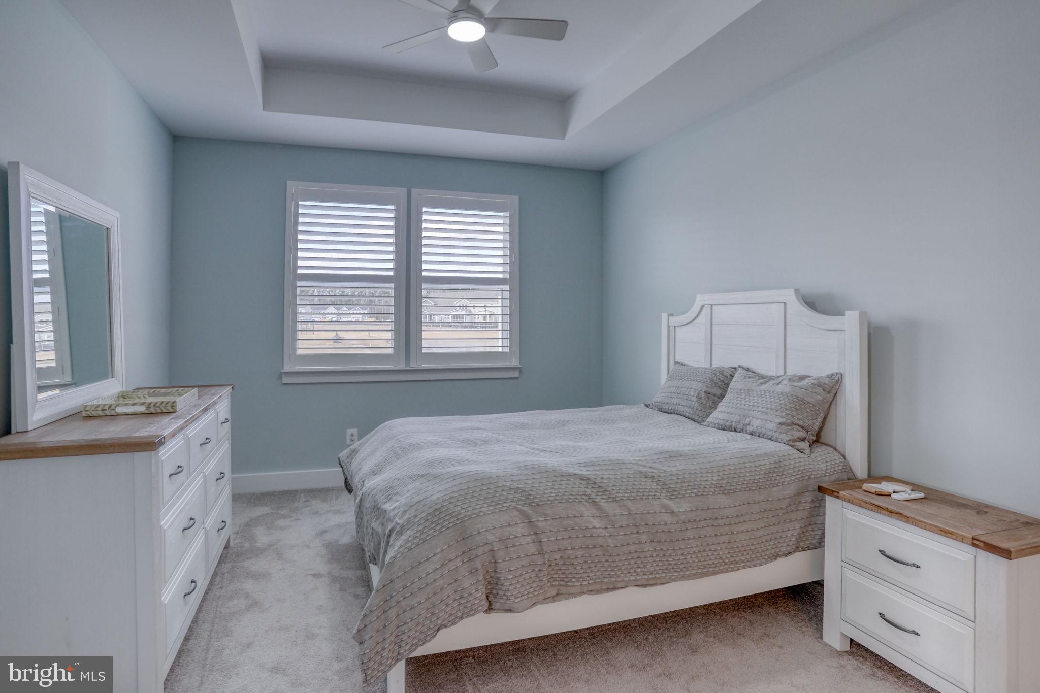 266 Exeter Street Ocean View, DE 19970 - Photo 20 of 62 a bedroom with a bed and a cabinets