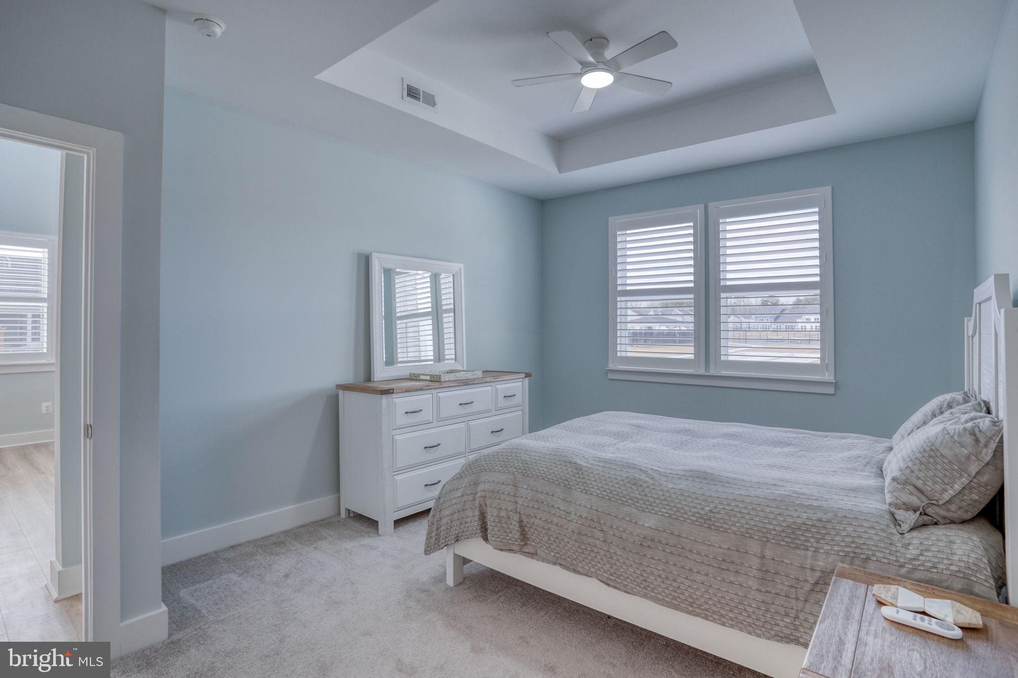 266 Exeter Street Ocean View, DE 19970 - Photo 21 of 62 a bedroom with a bed and a dresser
