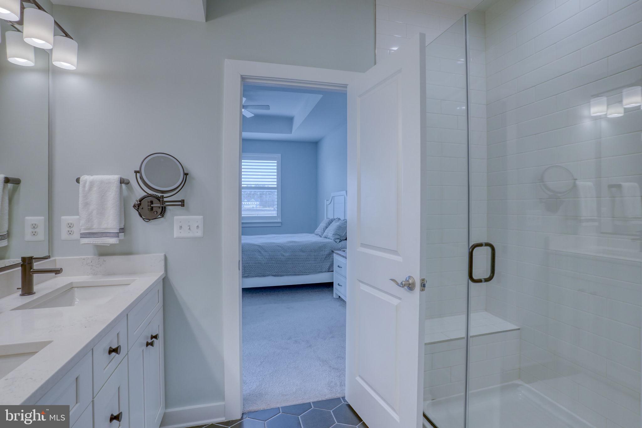 266 Exeter Street Ocean View, DE 19970 - Photo 23 of 62 a en suite bathroom with a granite countertop sink and a mirror