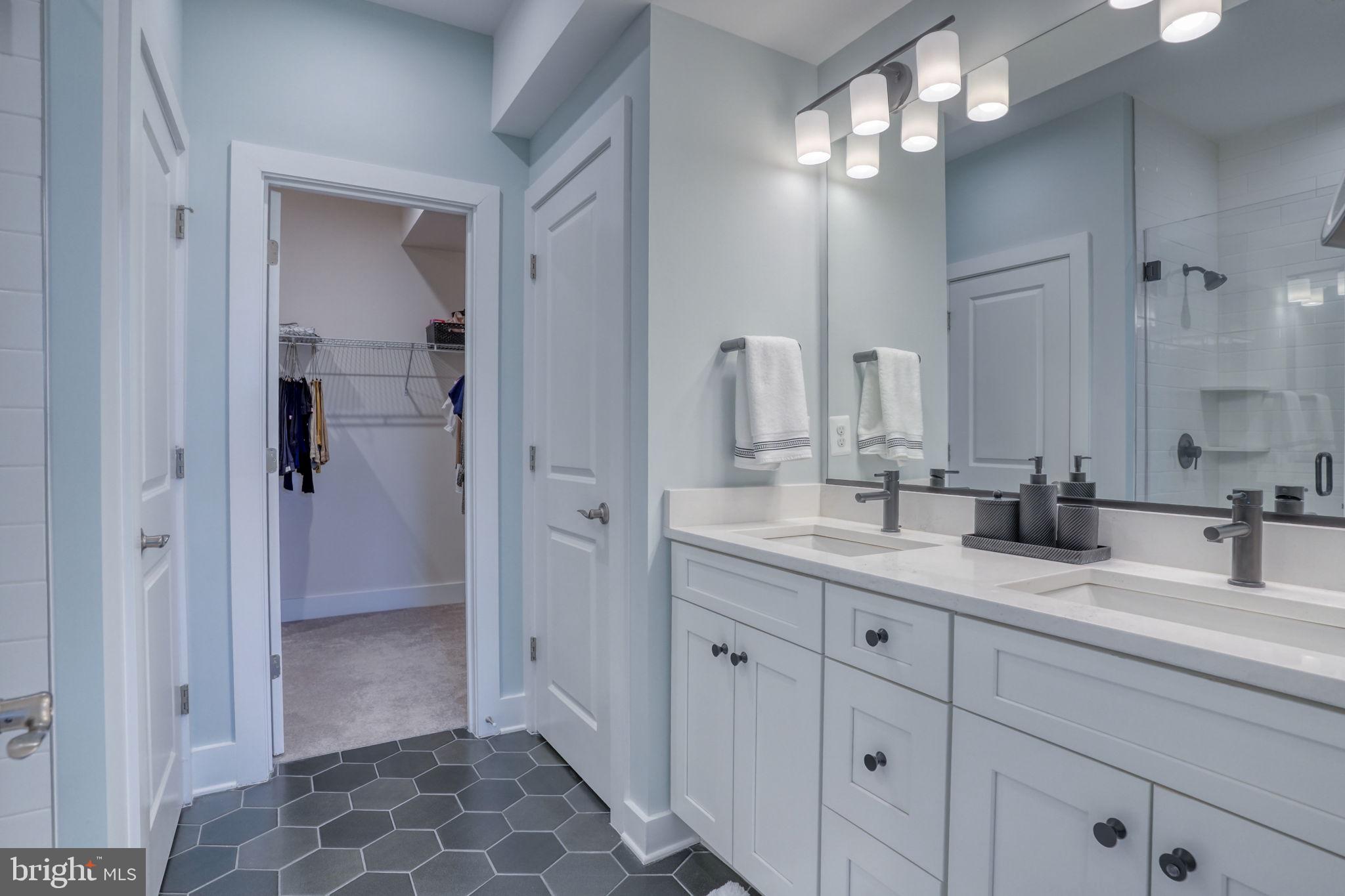 266 Exeter Street Ocean View, DE 19970 - Photo 25 of 62 a bathroom with a double vanity sink and a mirror