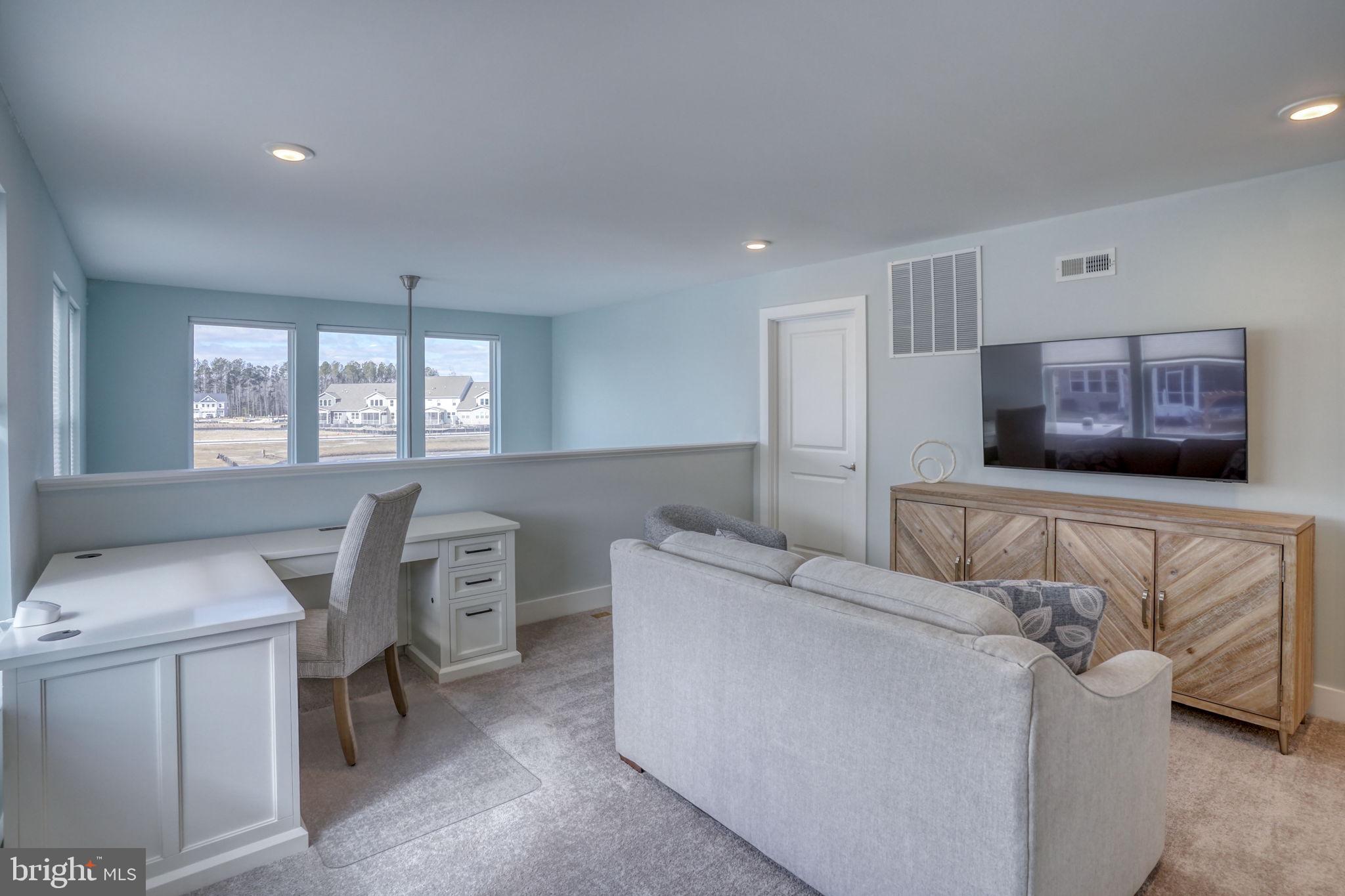 266 Exeter Street Ocean View, DE 19970 - Photo 26 of 62 a living room with furniture and a window