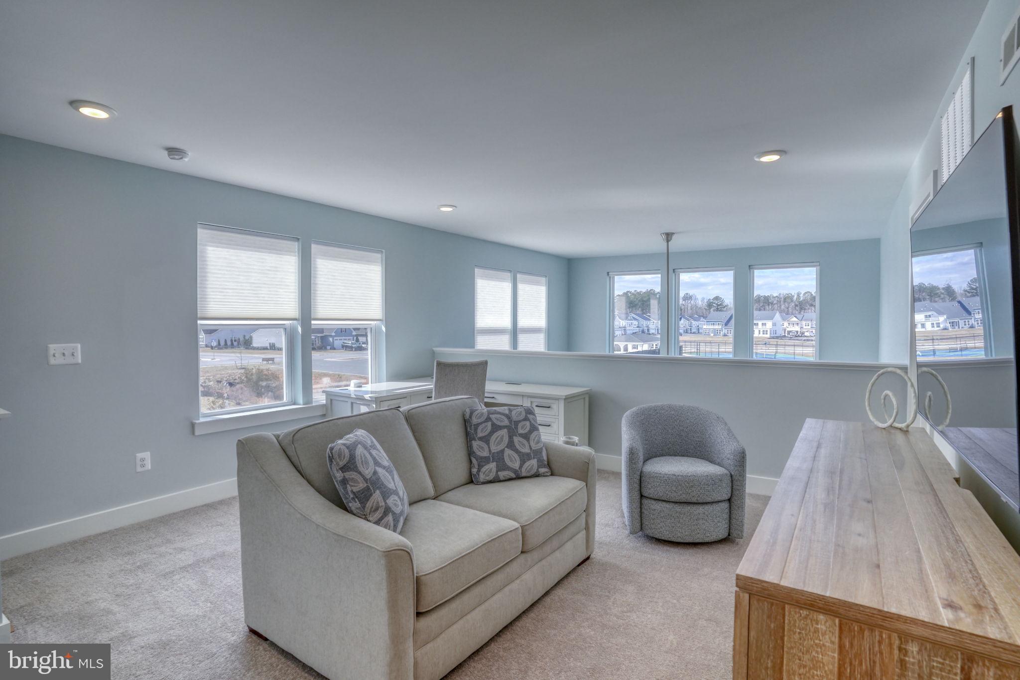 266 Exeter Street Ocean View, DE 19970 - Photo 27 of 62 a living room with furniture and a large window