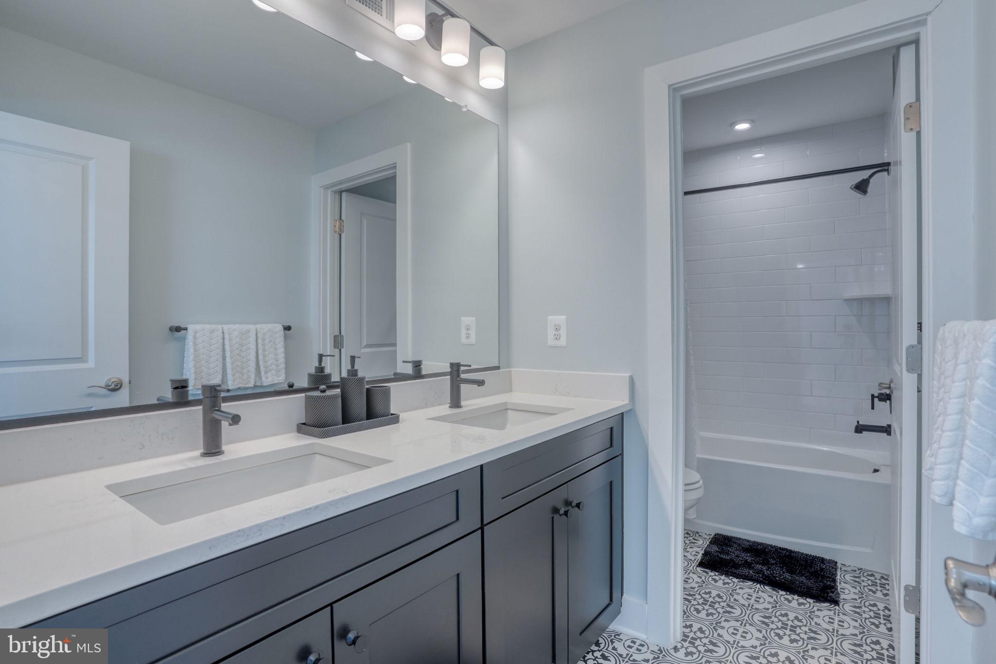 266 Exeter Street Ocean View, DE 19970 - Photo 29 of 62 a bathroom with a sink a toilet a shower and a mirror