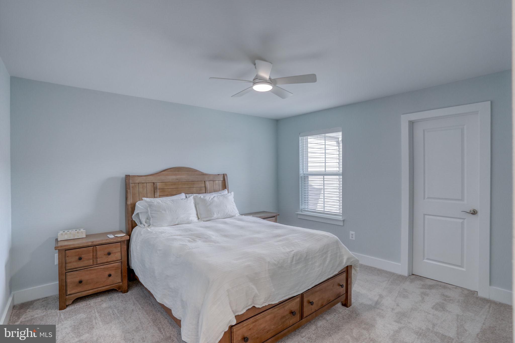 266 Exeter Street Ocean View, DE 19970 - Photo 30 of 62 a bedroom with a bed and a window