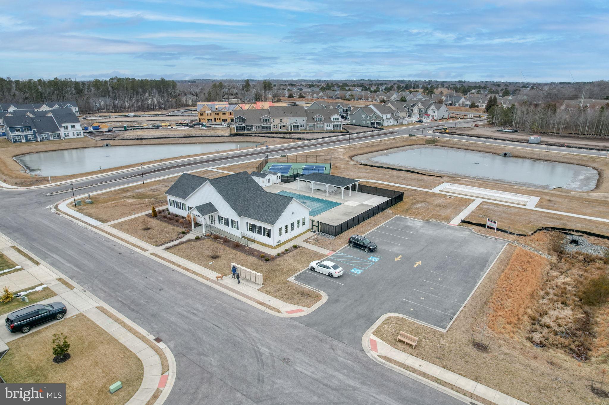 266 Exeter Street Ocean View, DE 19970 - Photo 34 of 62 a view of a swimming pool with lounge chairs
