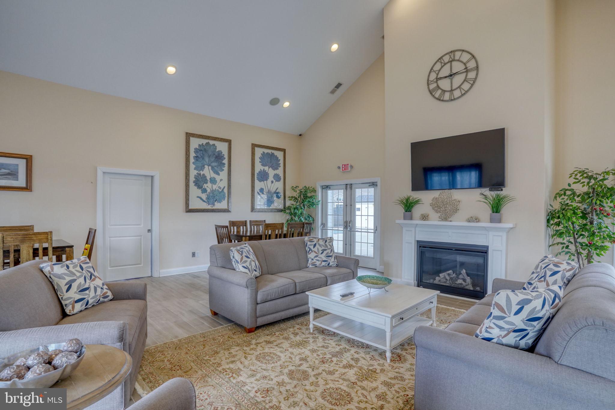 266 Exeter Street Ocean View, DE 19970 - Photo 41 of 62 a living room with furniture and a fireplace