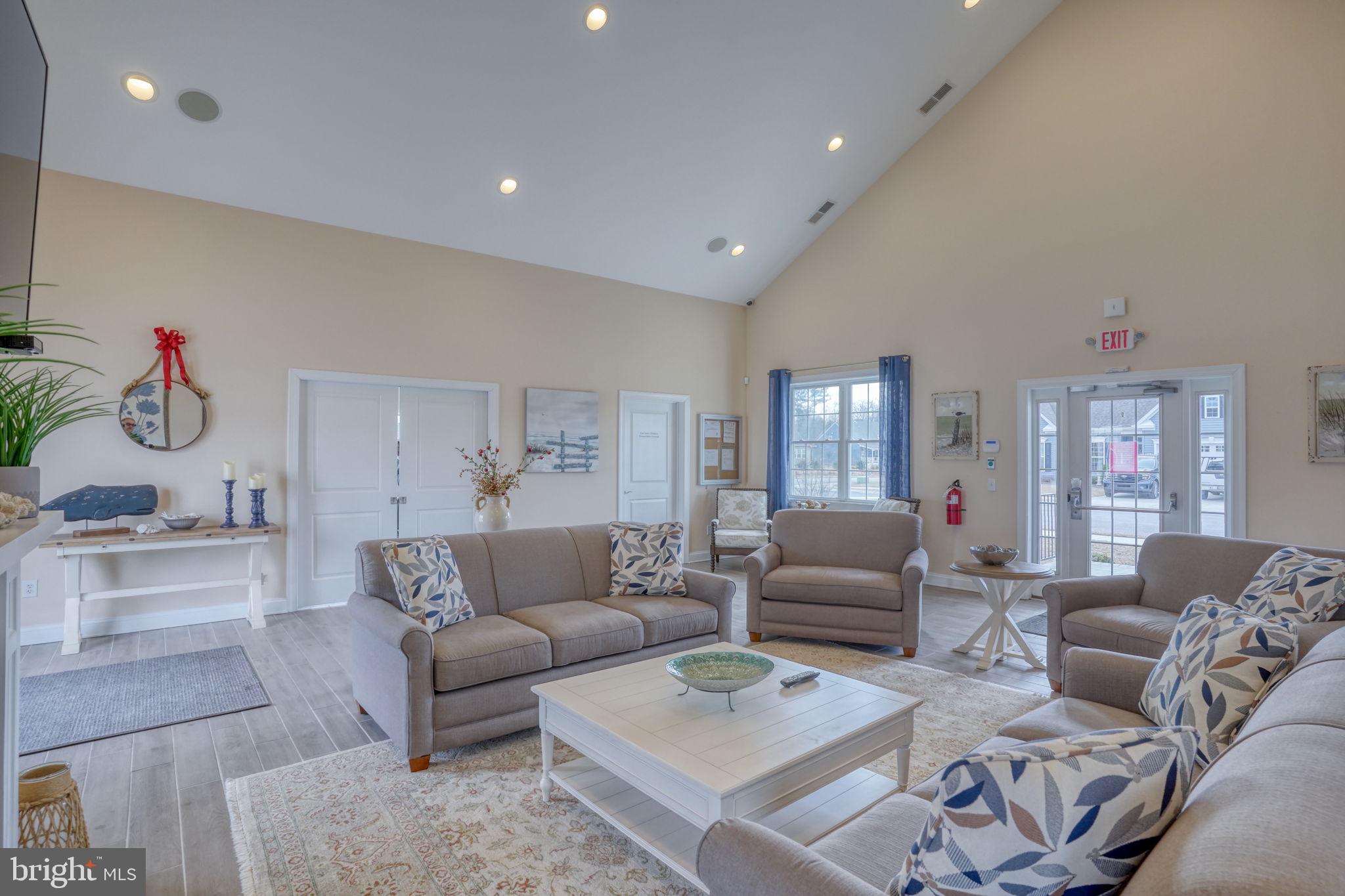 266 Exeter Street Ocean View, DE 19970 - Photo 44 of 62 a living room with furniture and a flat screen tv