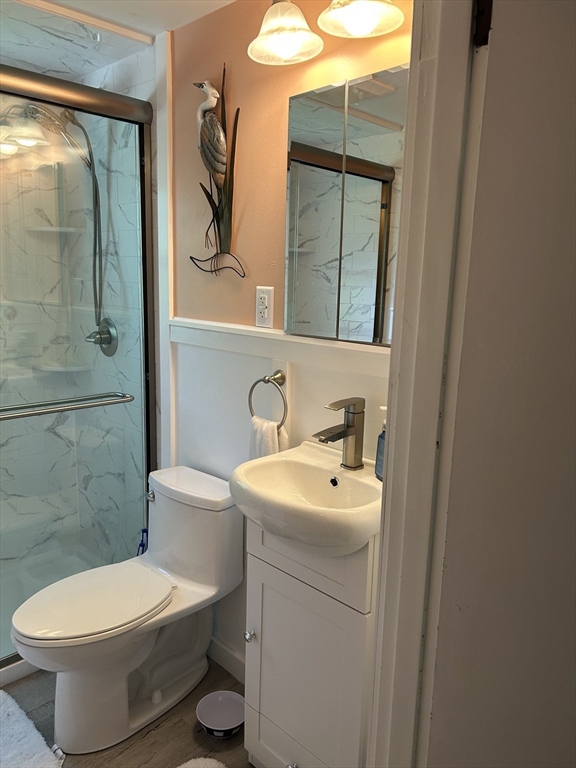 48 Smiths Lane Kingston, MA 02364 - Photo 18 of 22 a bathroom with a toilet sink and mirror